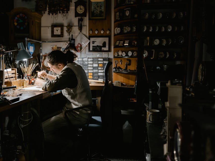 Master watchmaker repairing a luxury timepiece at Xodejuo workshop